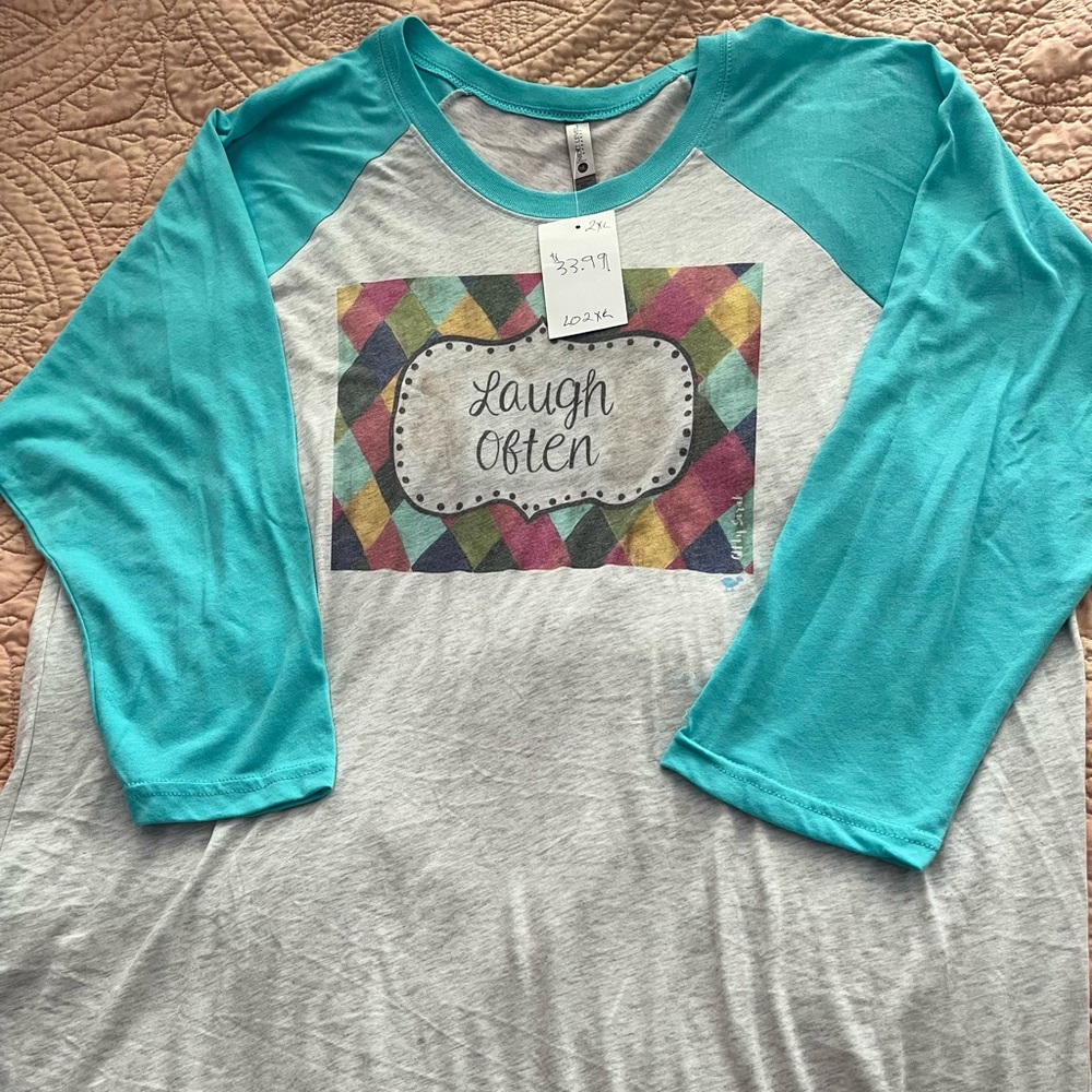 Size 2X baseball style shirt, long sleeves.